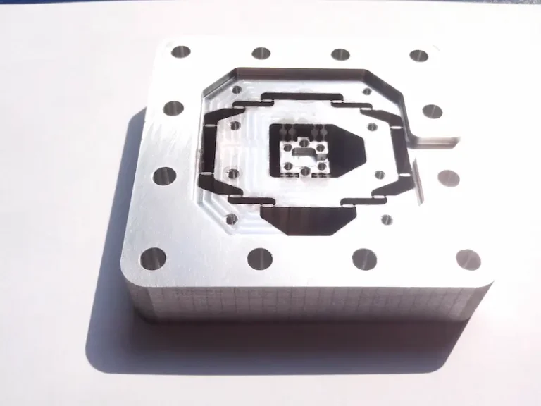 Double color injection molded part and overmolded plastic part comparison