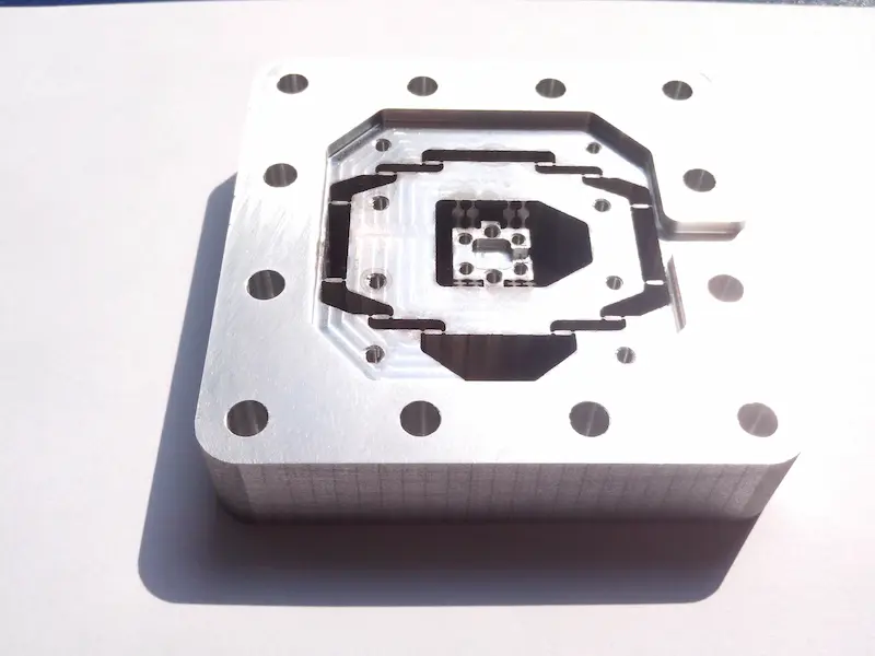 Double color injection molded part and overmolded plastic part comparison