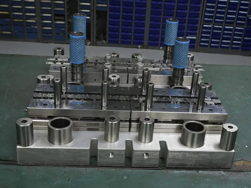 Injection molded plastic part showing moisture streaks and surface blister defects