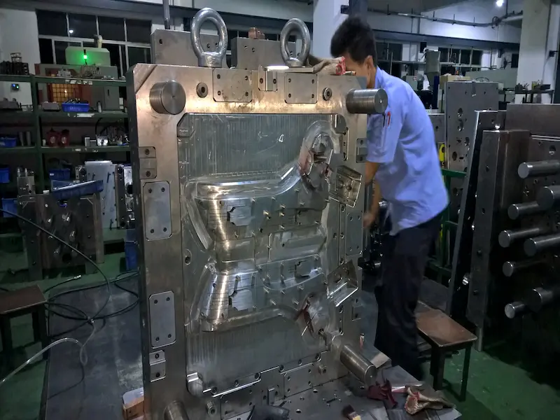 Injection molded plastic part showing weld line defect on glossy surface