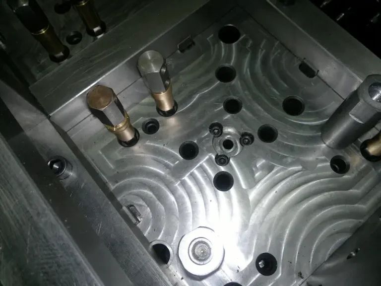 EDM spark machining process cutting a precision metal cavity in conductive hard material