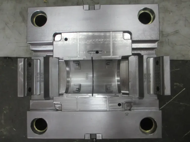 Injection molding machine showing molding pressure control during plastic part production
