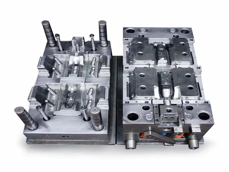 Large automotive injection molding machine producing complex plastic car parts with robotic automation