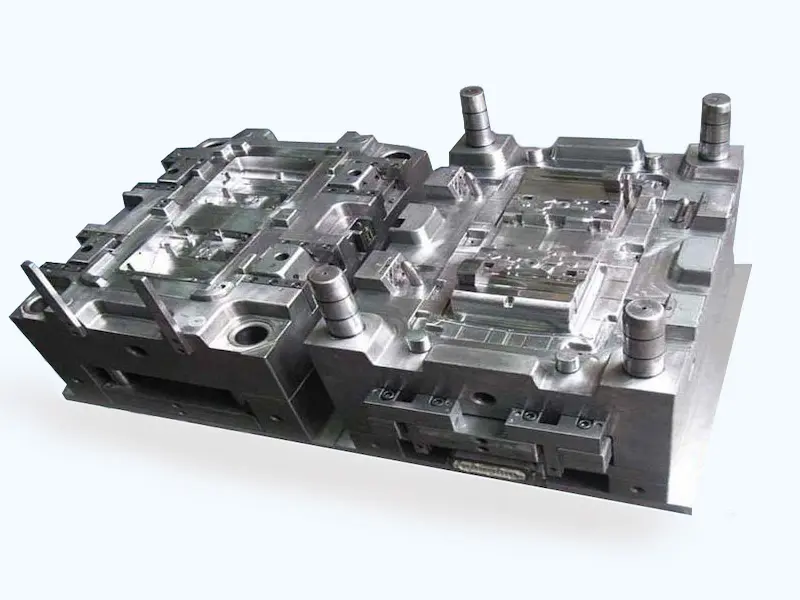 Technician performing maintenance on an injection mold hot runner ejector system and cooling lines