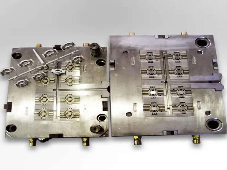 Damaged stamping die components being inspected for mold failure causes in a stamping workshop