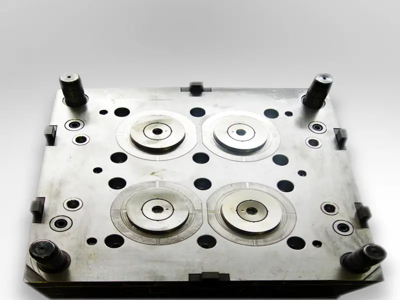 Engineers reviewing 3D printed prototypes and material options for product development