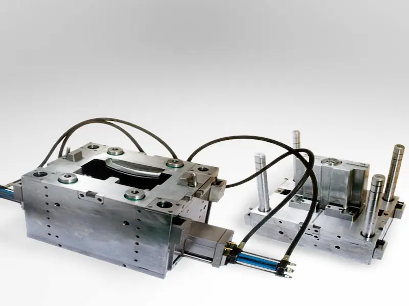 Sheet metal stamping die being inspected for jamming, misalignment, and mold sticking issues
