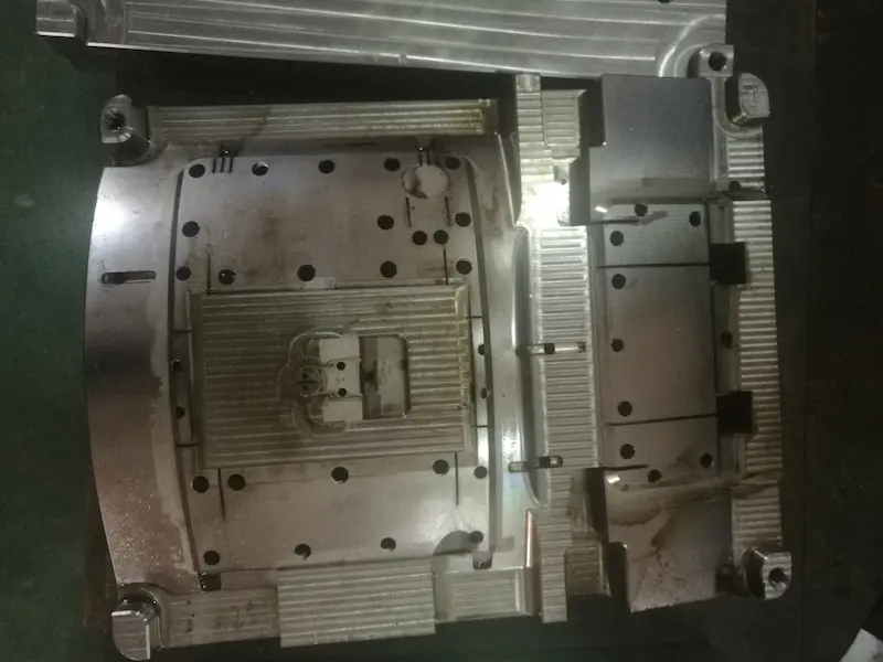 Injection molded plastic part with visible weld line defect near gate or insert area