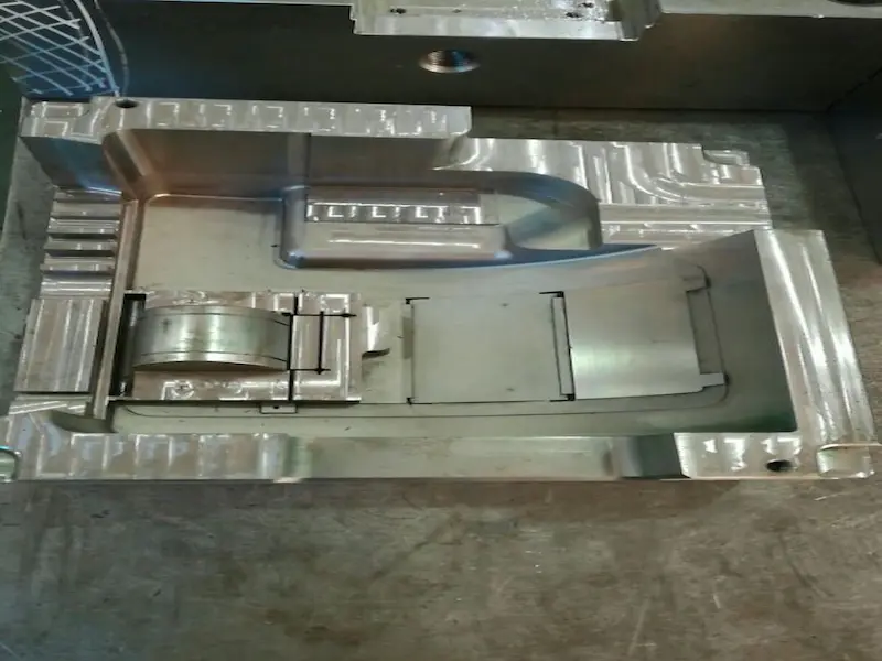 Two-color injection molding machine producing dual-color plastic components with rotating mold system