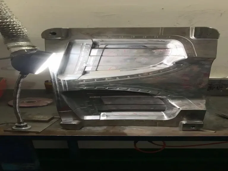 Damaged stamping die showing broken punch, worn guide post, trapped scrap, and stripper plate failure.