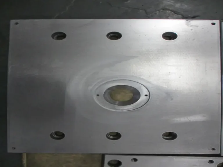 Aluminum alloy gravity casting mold with cooling channels, venting system, and permanent mold structure for casting production.