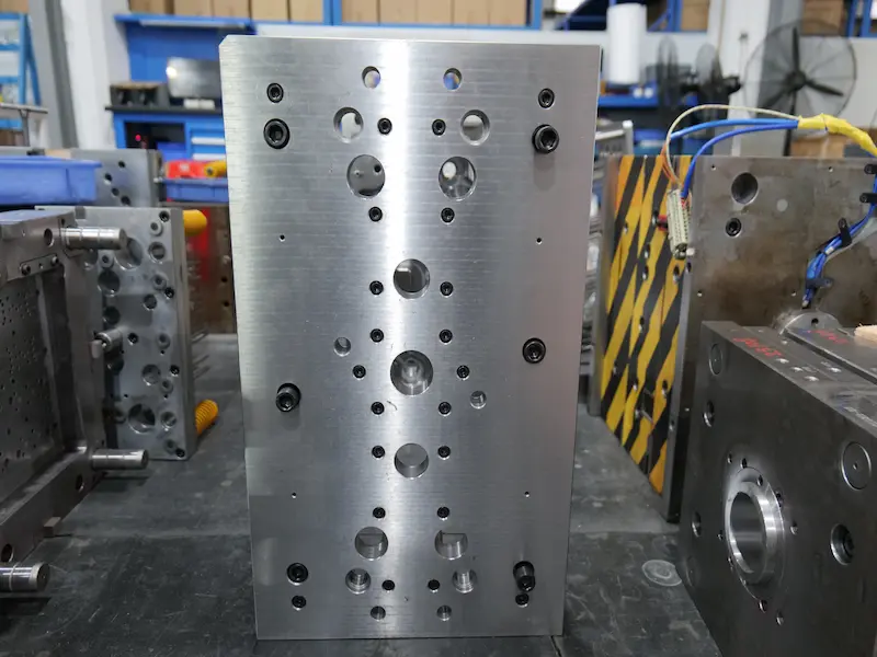 Two-color injection mold with rotating core structure for hard and soft plastic molding