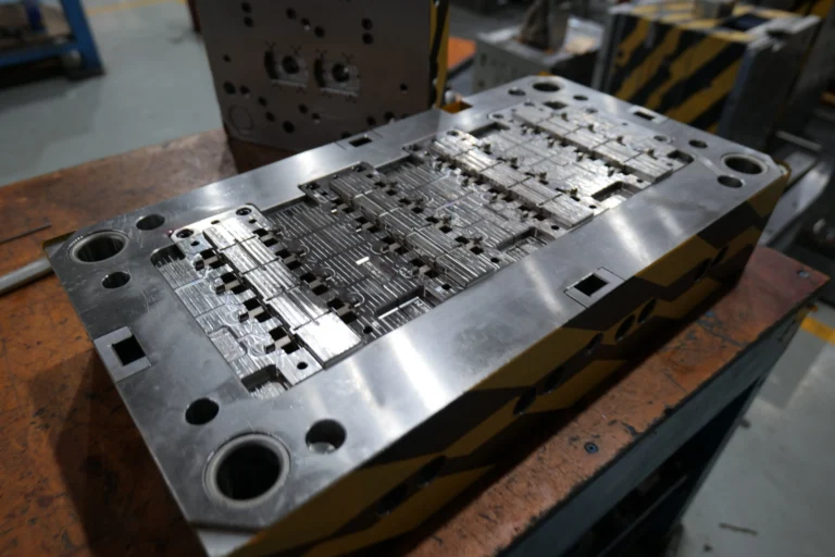 Precision mold components undergoing heat treatment to reduce deformation