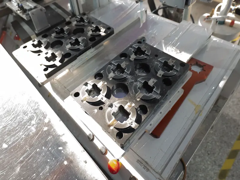 Wire EDM machining on mold steel showing altered surface layer and recast layer effects