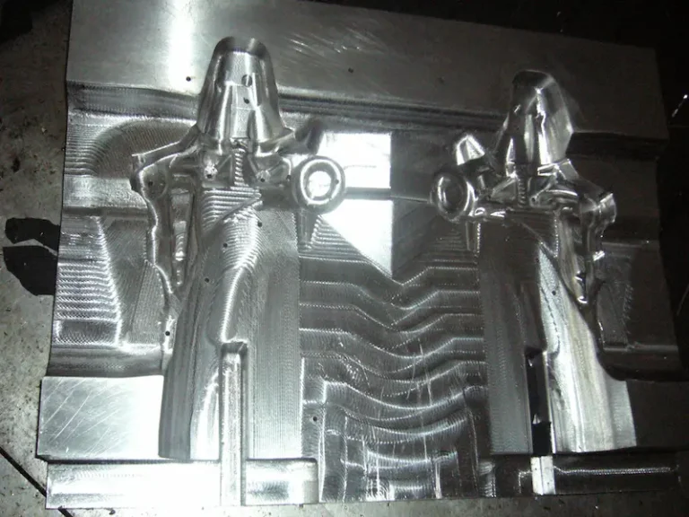 Precision stamping die polishing process showing mechanical polishing tools, mirror-finish die surfaces, and fine surface treatment methods.