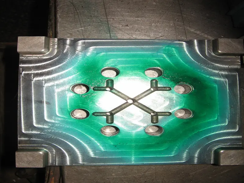 Die casting mold inspection showing thermal stress cracks, heat treatment effects, EDM surface conditions, and damaged mold areas.