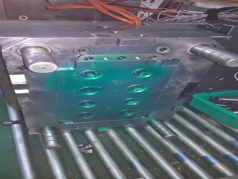 Green mold manufacturing concept showing reusable mold components, standard mold bases, recyclable materials, and sustainable production practices.