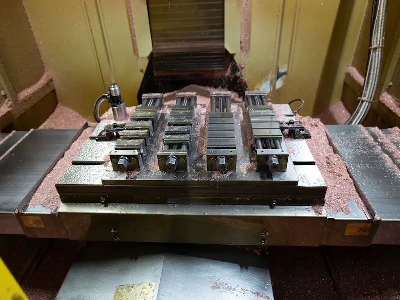 Engineer recording and analyzing injection molding trial data for mold correction and stable production