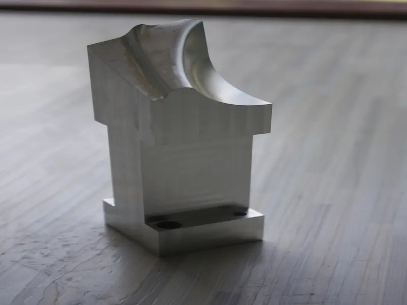 Tapping process creating internal threads in a precision machined metal hole