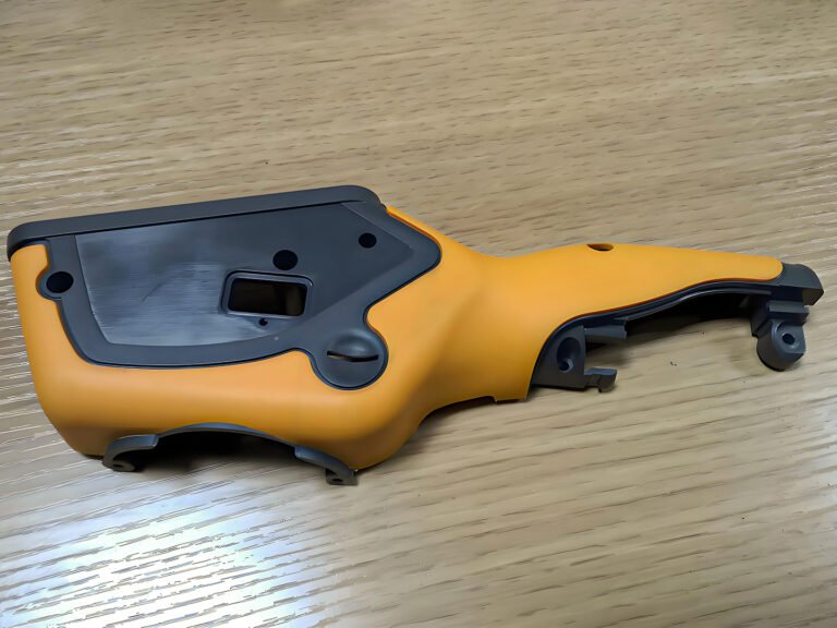 Ergonomic plastic housing for handheld consumer device