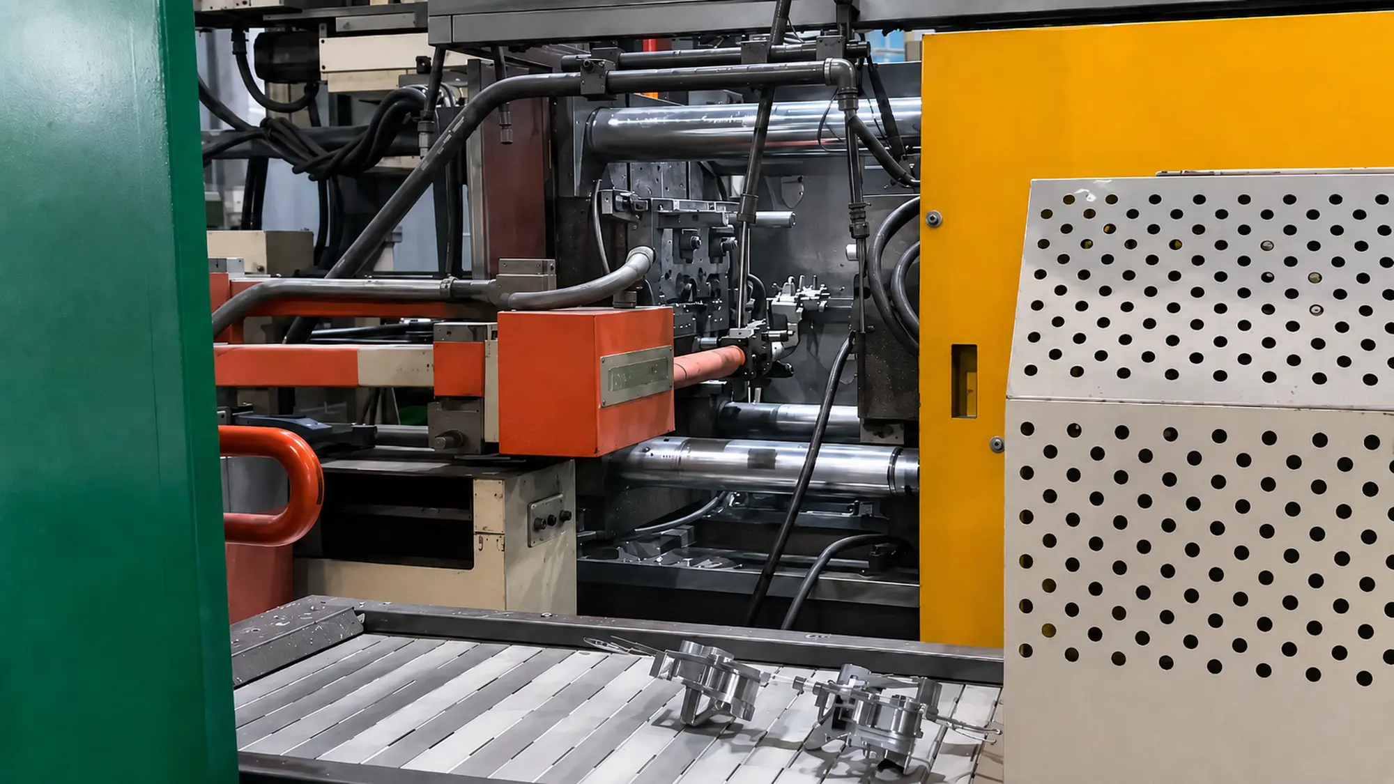 Automated extraction system removing newly cast metal parts from a high-pressure die casting machine