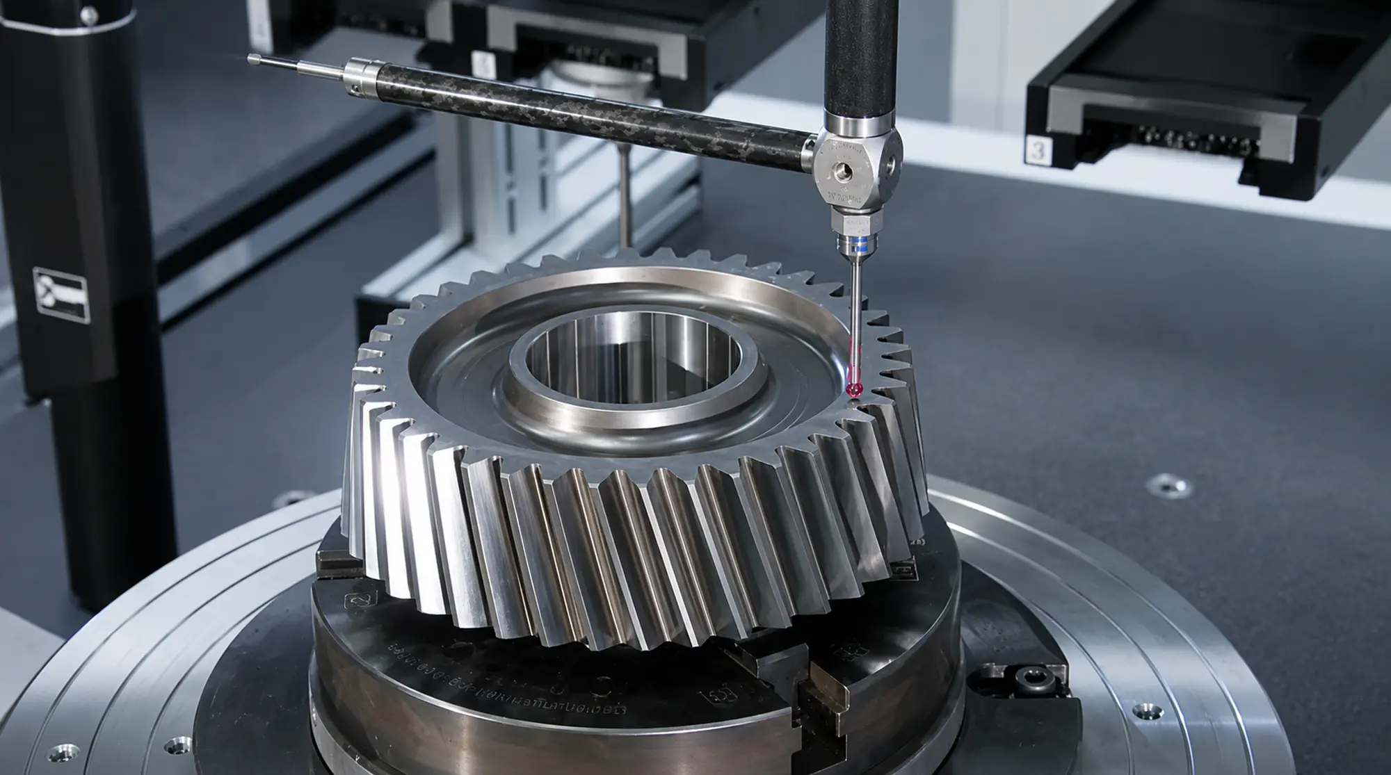 Coordinate measuring machine inspecting a machined gear for critical dimensions and geometric accuracy