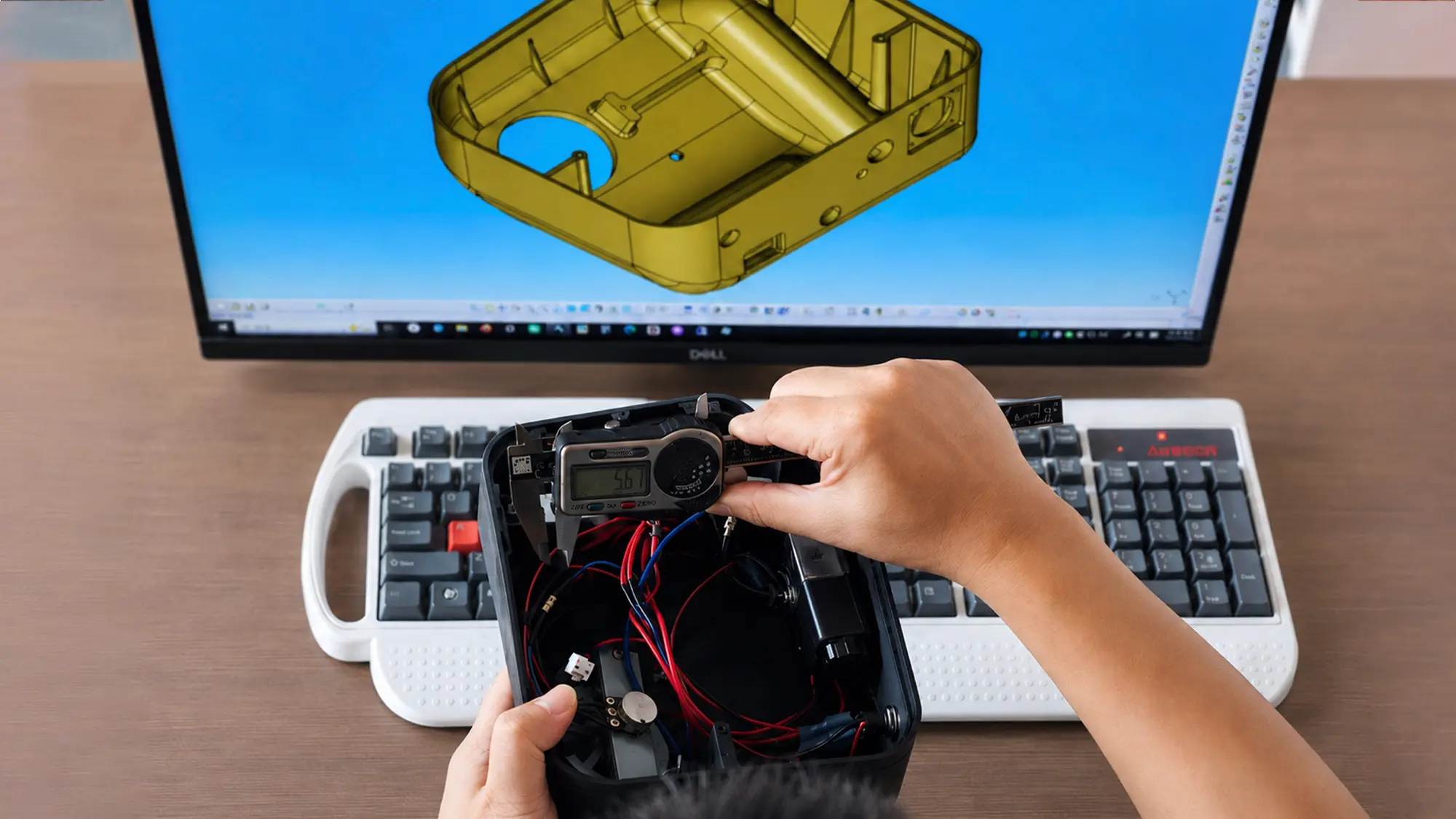 Engineer inspecting a prototype part before mold making and production