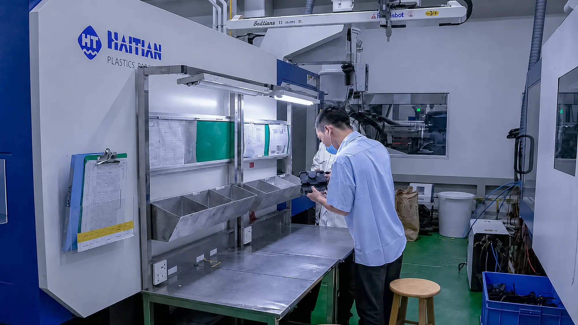 Inspector measuring a production part to verify critical dimensions during first article and in-process inspection